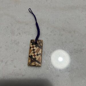 Handcrafted Wooden Puzzle Pattern Pendant with Purple Cord